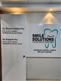 SMILE SOLUTIONS ADVANCED DENTAL CARE AND  IMPLANT CENTER